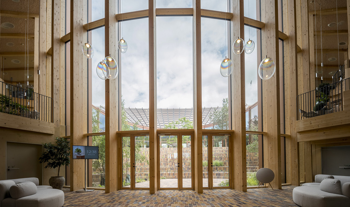 Stellar Nebula pendants suspended in front of the building’s large glazed façade.