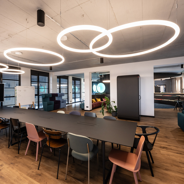 Image of the meeting room illuminated by various Alphabet of Light Circular.