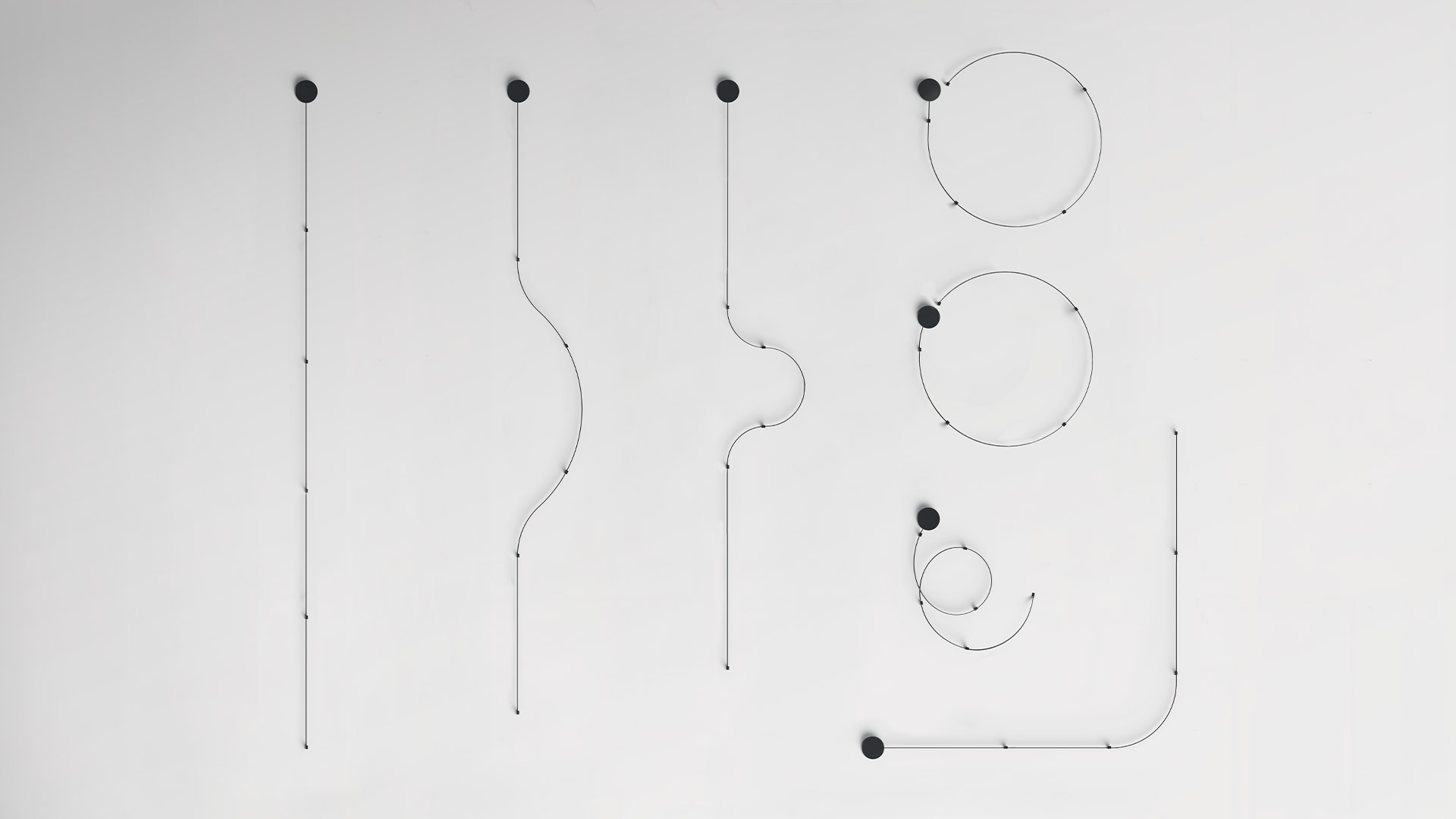 Artemide Sylt Stand Alone installation kit: black flat cable coil, circular canopy, and multiple small black connectors/clips