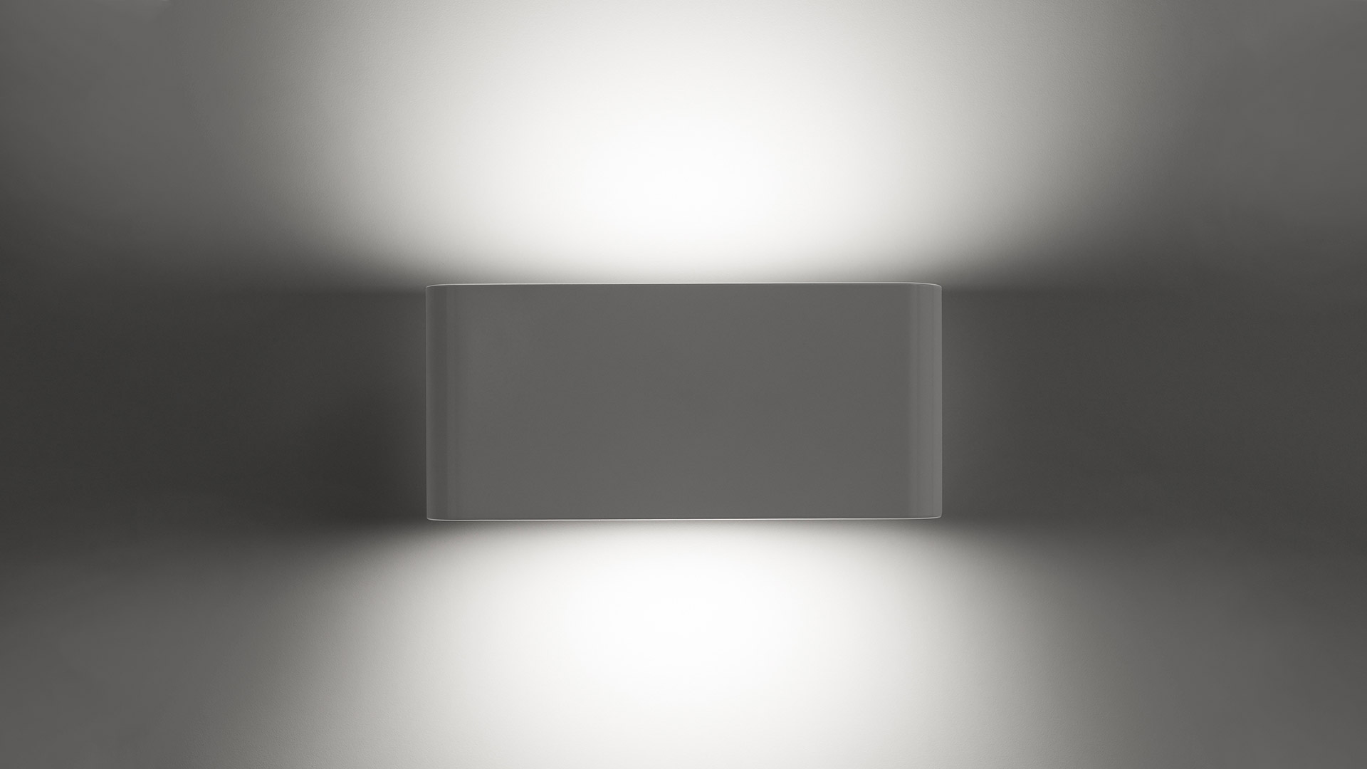 Applique Artemide Two Flags Parete che emette fasci di luce morbidi verso l'alto e verso il basso su parete grigia neutra